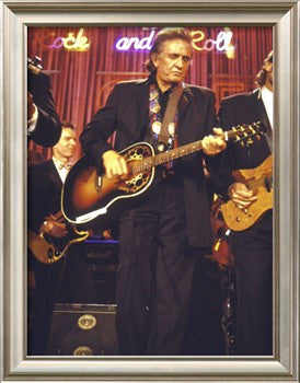 Johnny Cash Performing on Stage Framed Print