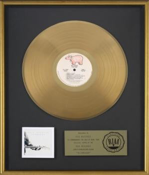 ERIC CLAPTON GOLD RECORD AWARD FOR "SLOWHAND"