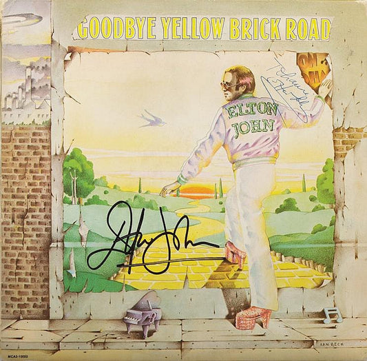 Elton John twice signed “Goodbye Yellow Brick Road